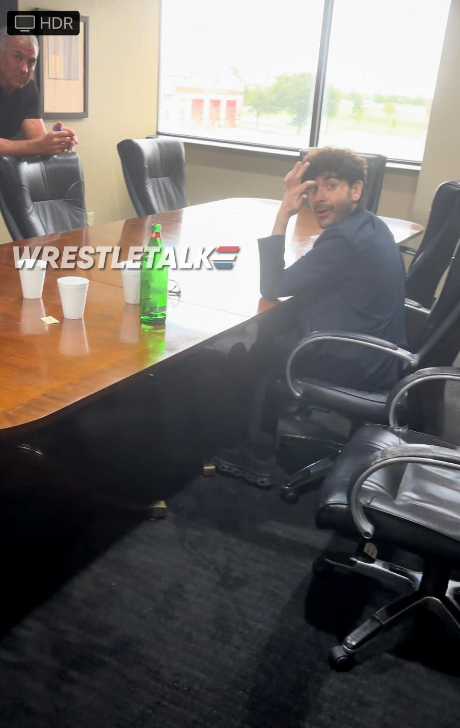 Photo of AEW CEO Tony Khan meeting with Shane McMahon
