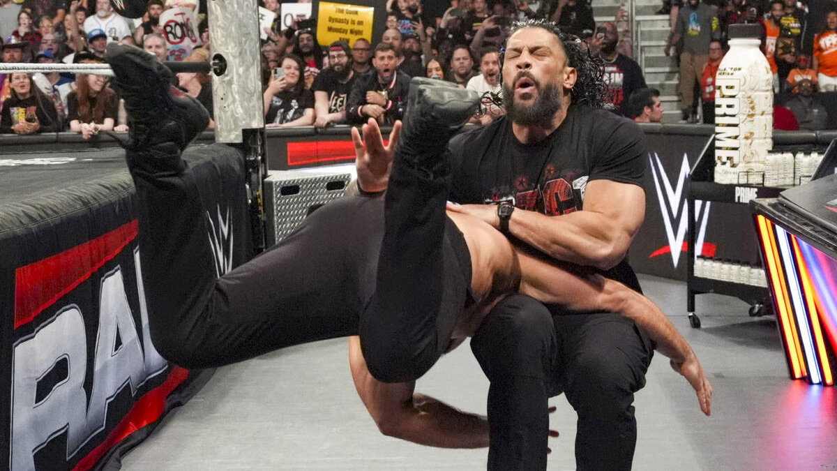 Bron Breakker hitting a Spear on Roman Reigns on WWE Raw