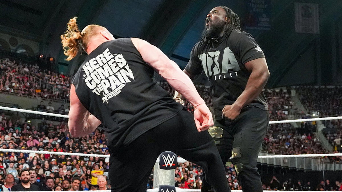 WWE's Brock Lesnar low blowing Oba Femi