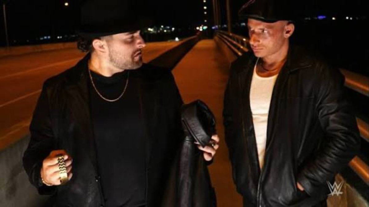NXT Tony D'Angelo and Channing "Stacks" Lorenzo after throwing Two Dimes off a bridge